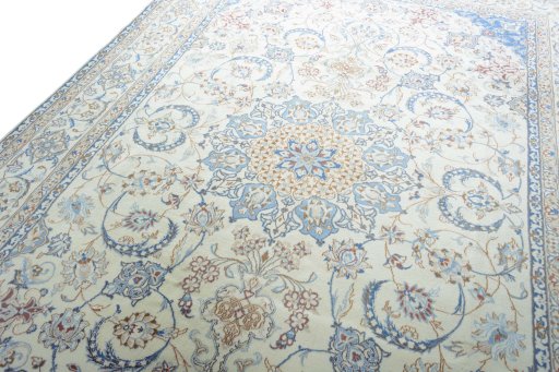 Backside of handmade New Nain rug showing knot structure and weave density