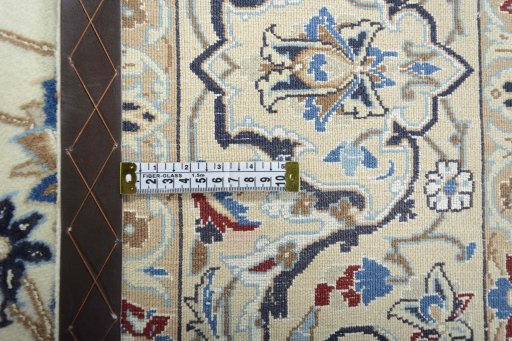 Backside of handmade New Nain rug showing knot structure and weave density