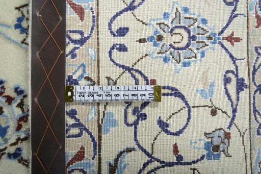 Backside of handmade New Nain rug showing knot structure and weave density