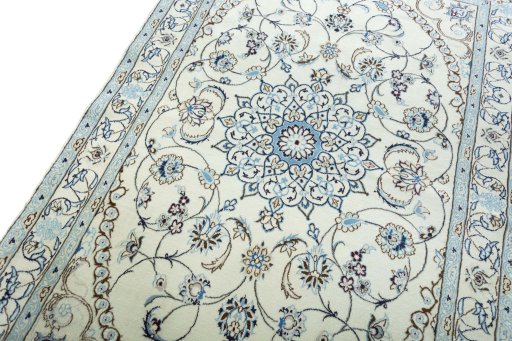 Backside of handmade New Nain rug showing knot structure and weave density