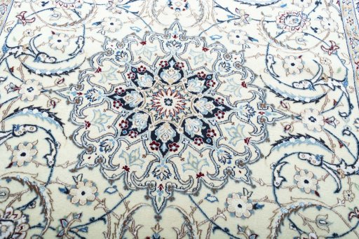 Backside of handmade New Nain rug showing knot structure and weave density