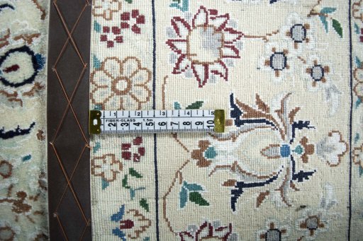 Backside of handmade New Nain rug showing knot structure and weave density
