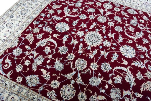 Backside of handmade New Nain rug showing knot structure and weave density