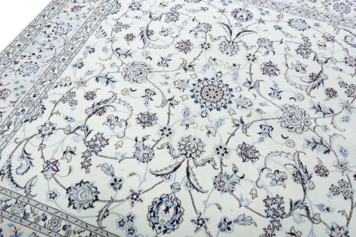 Backside of handmade New Nain rug showing knot structure and weave density