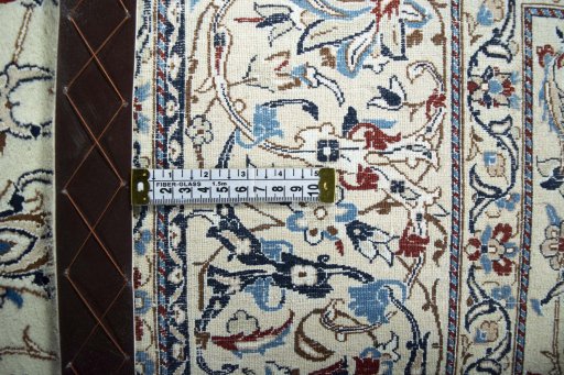 Backside of handmade 2000s Nain rug showing knot structure and weave density