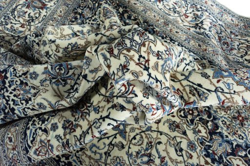 Surface texture of 2000s Nain rug with natural Cork and intricate pattern