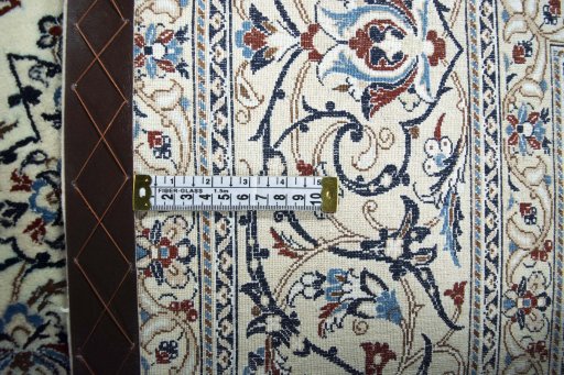 Backside of handmade 2000s Nain rug showing knot structure and weave density