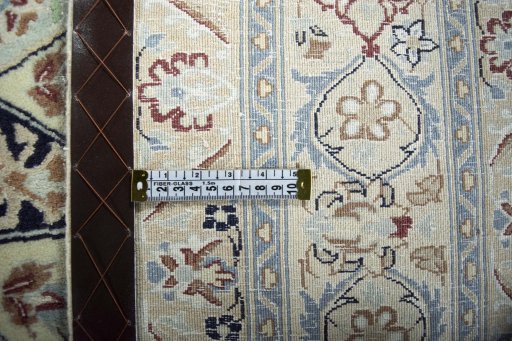 Backside of handmade 2000s Nain rug showing knot structure and weave density