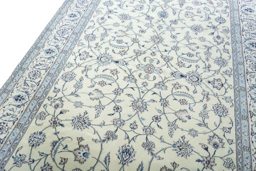 Backside of handmade New Nain rug showing knot structure and weave density