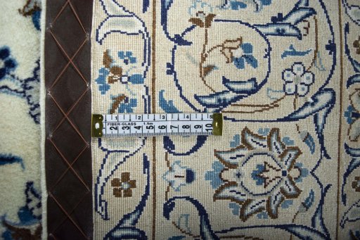 Backside of handmade New Nain rug showing knot structure and weave density