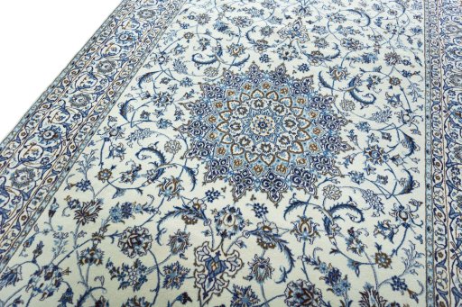 Backside of handmade New Nain rug showing knot structure and weave density