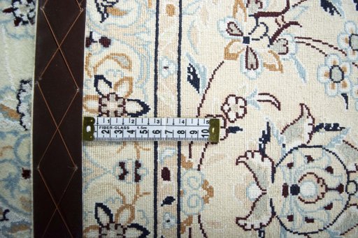 Backside of handmade New Nain rug showing knot structure and weave density