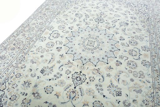 Backside of handmade New Nain rug showing knot structure and weave density