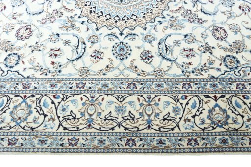 Corner detail of New Nain rug showing border pattern and Wool pile
