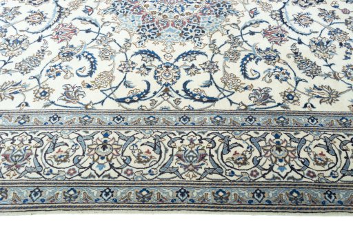 Corner detail of New Nain rug showing border pattern and Wool pile
