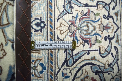 Backside of handmade New Nain rug showing knot structure and weave density