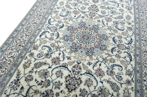 Backside of handmade New Nain rug showing knot structure and weave density