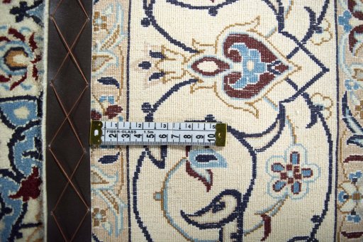 Backside of handmade New Nain rug showing knot structure and weave density