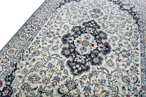 Backside of handmade New Nain rug showing knot structure and weave density