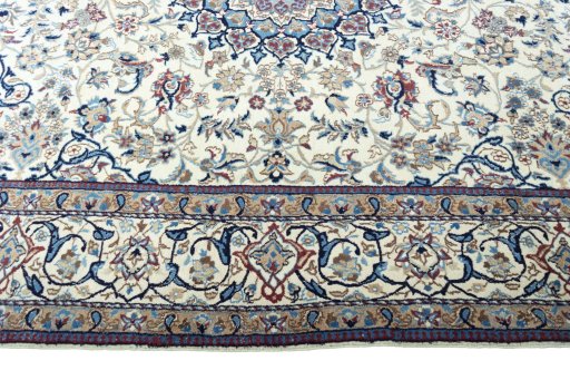 Corner detail of 2000s Nain rug showing border pattern and Wool pile