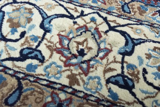 Close-up detail of 2000s Nain rug from Iran / Persia showing Wool weave