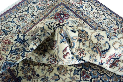 Surface texture of 2000s Nain rug with natural Wool and intricate pattern