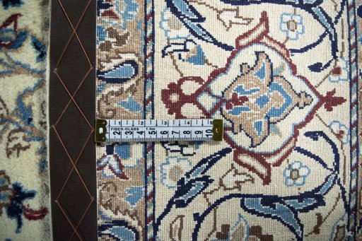 Backside of handmade 2000s Nain rug showing knot structure and weave density