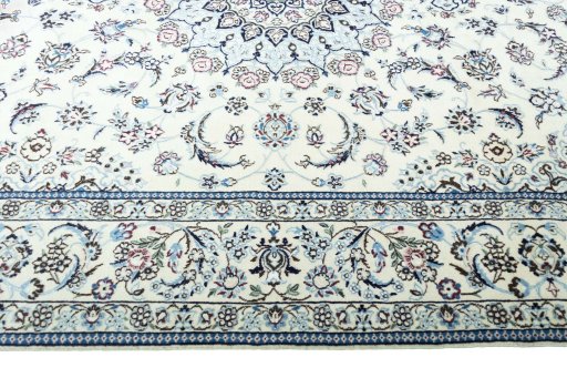 Corner detail of New Nain rug showing border pattern and Wool pile