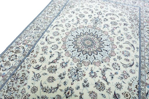 Backside of handmade New Nain rug showing knot structure and weave density