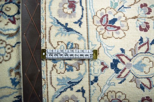 Backside of handmade New Nain rug showing knot structure and weave density