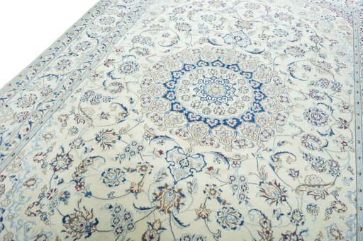 Backside of handmade New Nain rug showing knot structure and weave density