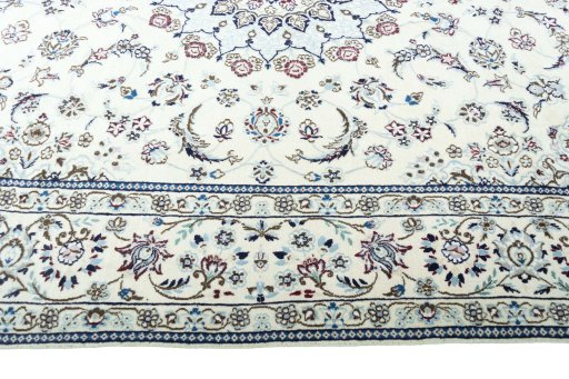 Corner detail of 2000s Nain rug showing border pattern and Wool pile