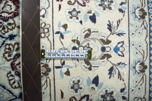 Backside of handmade 2000s Nain rug showing knot structure and weave density