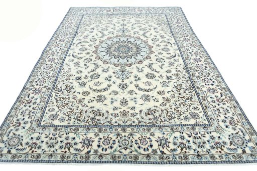 Surface texture of 2000s Nain rug with natural Wool and intricate pattern