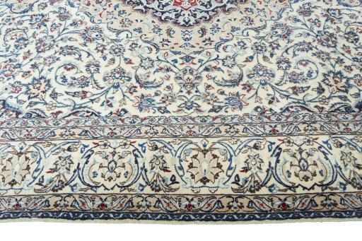 Corner detail of 2000s Nain rug showing border pattern and Wool pile
