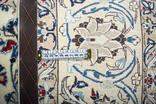 Backside of handmade 2000s Nain rug showing knot structure and weave density