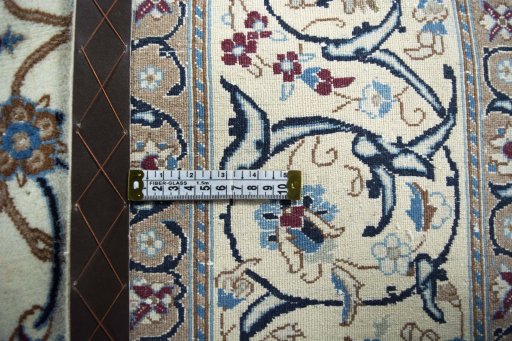 Backside of handmade 2000s Nain rug showing knot structure and weave density