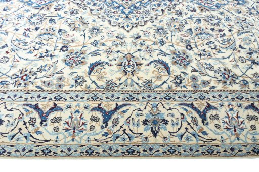Corner detail of 2000s Nain rug showing border pattern and Wool pile