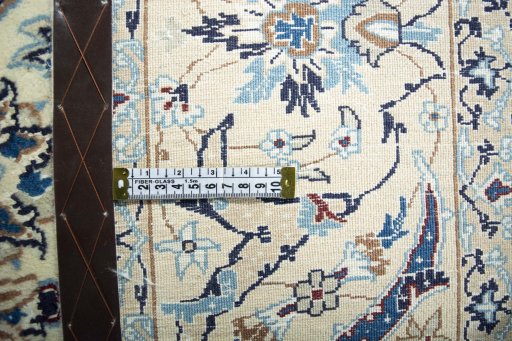 Backside of handmade 2000s Nain rug showing knot structure and weave density