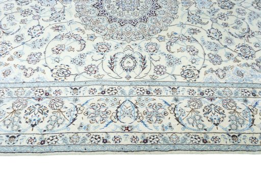 Corner detail of New Nain rug showing border pattern and Wool pile