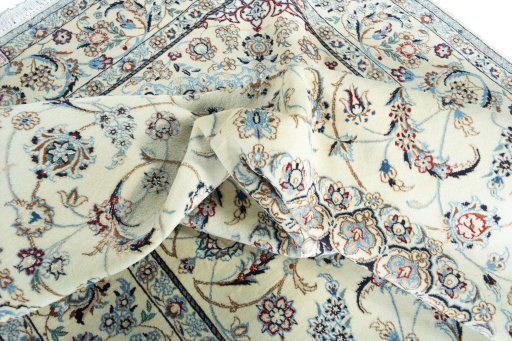 Surface texture of 2000s Nain rug with natural Wool and intricate pattern