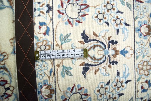 Backside of handmade 2000s Nain rug showing knot structure and weave density