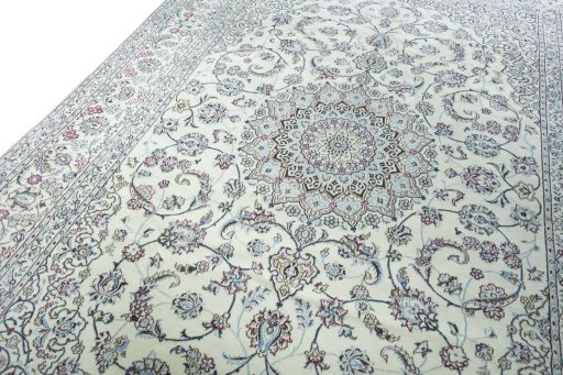 Backside of handmade New Nain rug showing knot structure and weave density