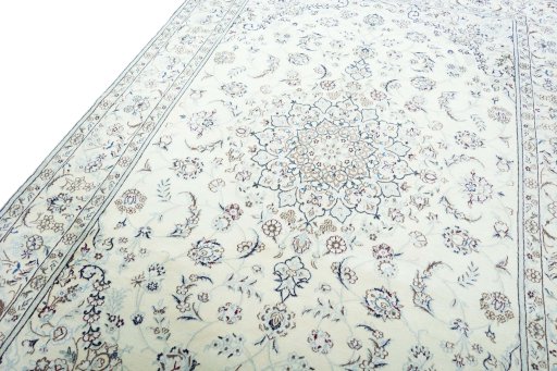 Backside of handmade New Nain rug showing knot structure and weave density