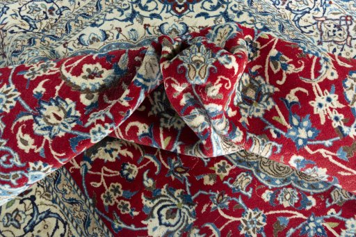 Surface texture of 2000s Nain rug with natural Wool and intricate pattern