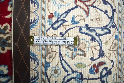 Backside of handmade 2000s Nain rug showing knot structure and weave density