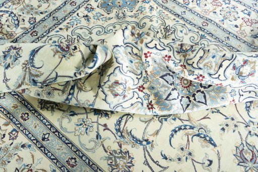 Surface texture of 2000s Nain rug with natural Wool and intricate pattern