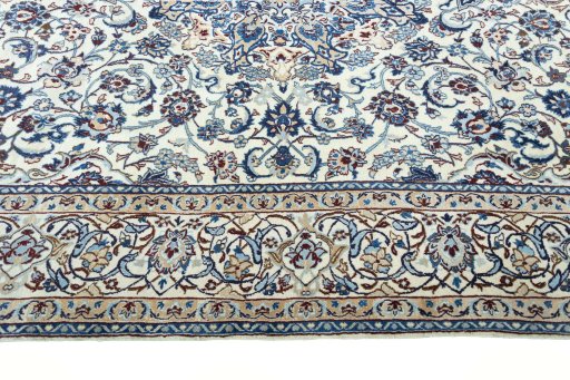 Corner detail of 2000s Nain rug showing border pattern and Wool pile