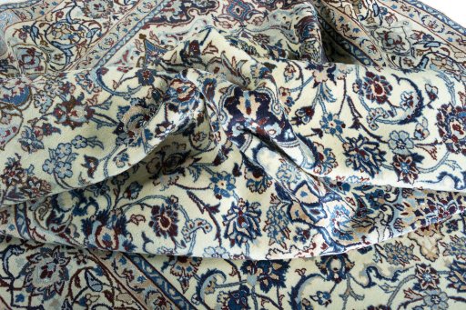 Surface texture of 2000s Nain rug with natural Wool and intricate pattern