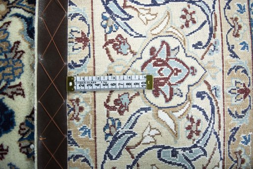 Backside of handmade 2000s Nain rug showing knot structure and weave density